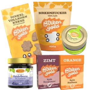 Produkte der Marke Birkengold: Dinkelkekse, Birkenzucker, Zahnputzpulver, Heidelbeermarmelade, Xylit Bonbons und Kaugummi.